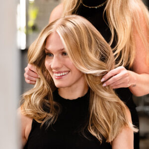 Professional Aveda root retouch and hair color service at Fusion Salon in Jacksonville.