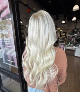 Platinum blonde bleach and tone hair color by a master stylist at Fusion Salon in Jacksonville, Florida.